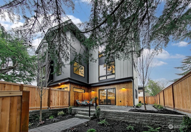 back of house with a patio