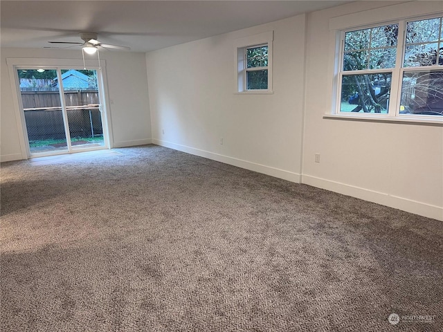 spare room featuring carpet floors and ceiling fan