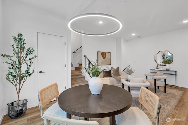 dining space with light wood-type flooring