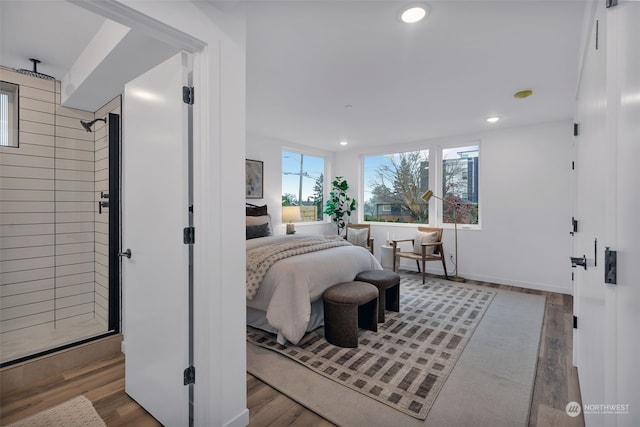 bedroom with hardwood / wood-style floors