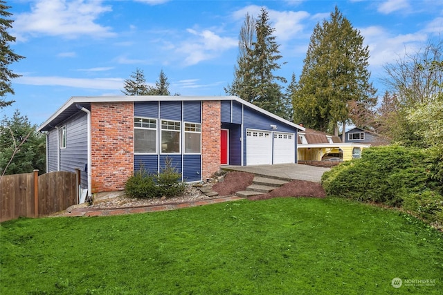 view of front of house with a garage and a front yard