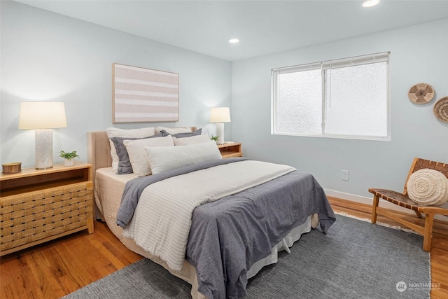 bedroom with hardwood / wood-style floors