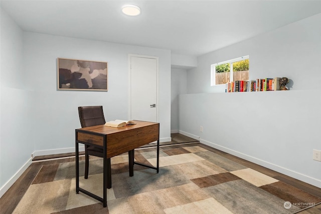 office with dark wood-type flooring