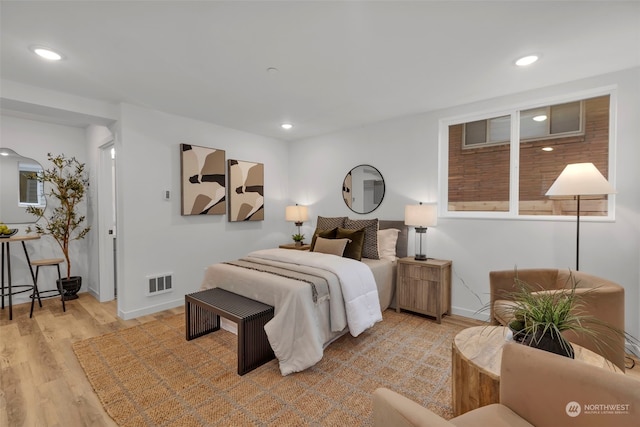 bedroom featuring light hardwood / wood-style floors