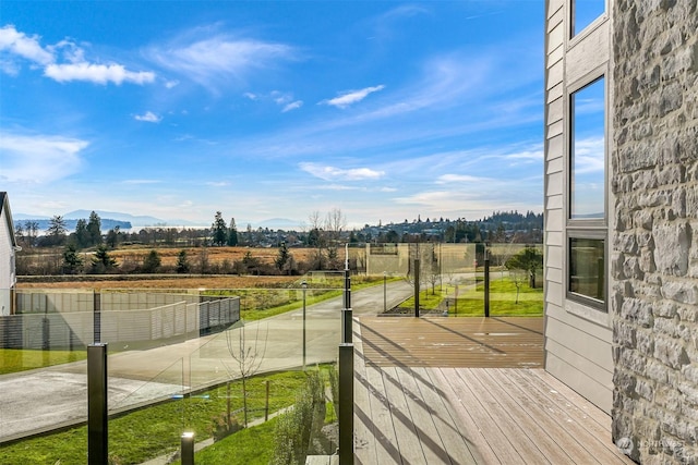 wooden deck with a mountain view