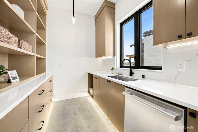 kitchen with light stone countertops, open shelves, a sink, hanging light fixtures, and dishwasher