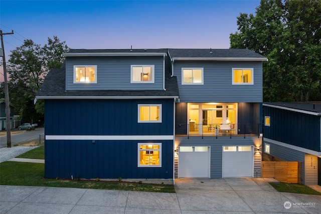 contemporary house with a balcony and a garage