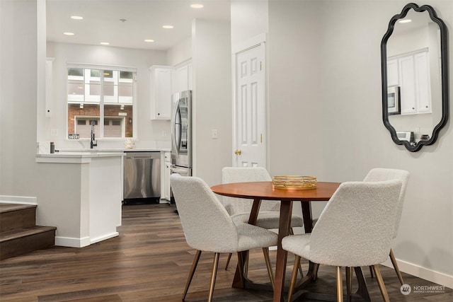 dining room featuring dark wood-type flooring