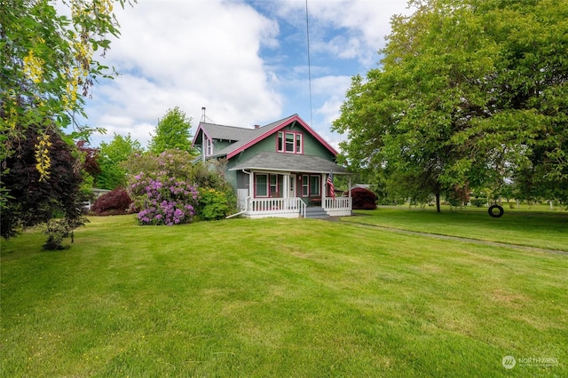 view of front of property with a porch and a front yard