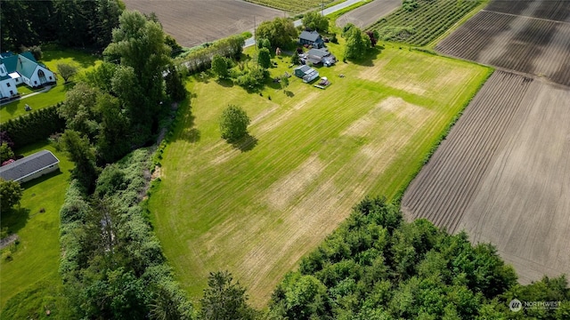 birds eye view of property with a rural view