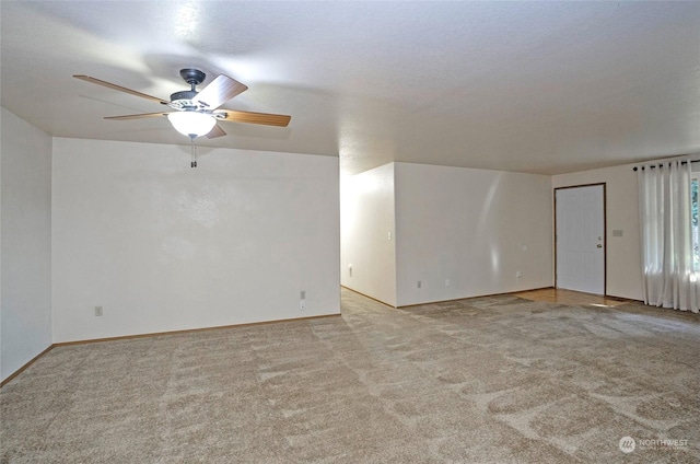 empty room with light carpet and ceiling fan