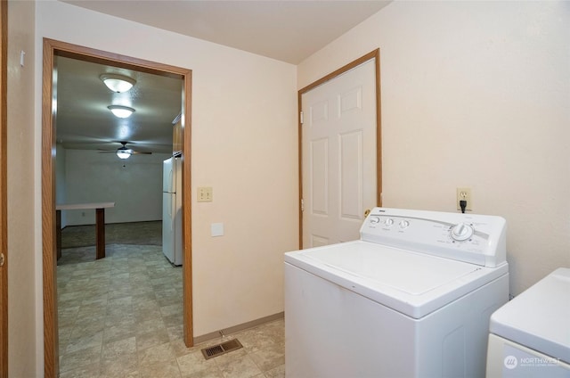 clothes washing area featuring washing machine and clothes dryer