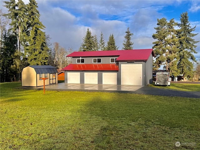 view of outbuilding with a garage and a lawn