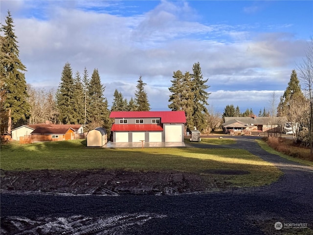 exterior space with a storage unit and a garage