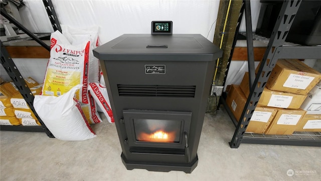 room details featuring concrete floors and a wood stove