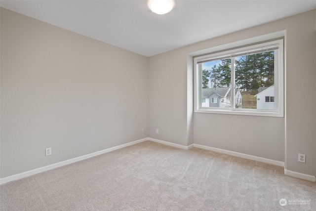 empty room featuring light colored carpet