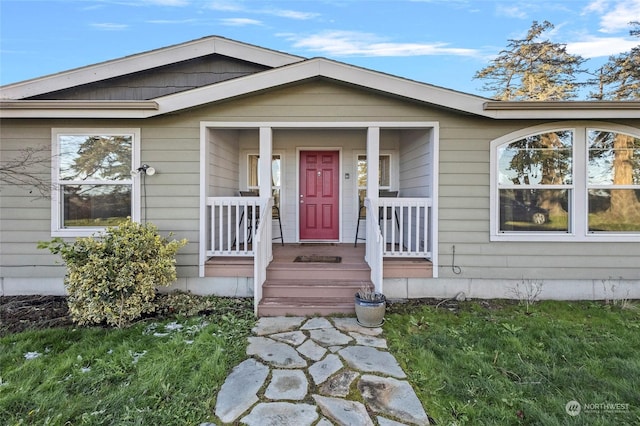 entrance to property featuring a porch