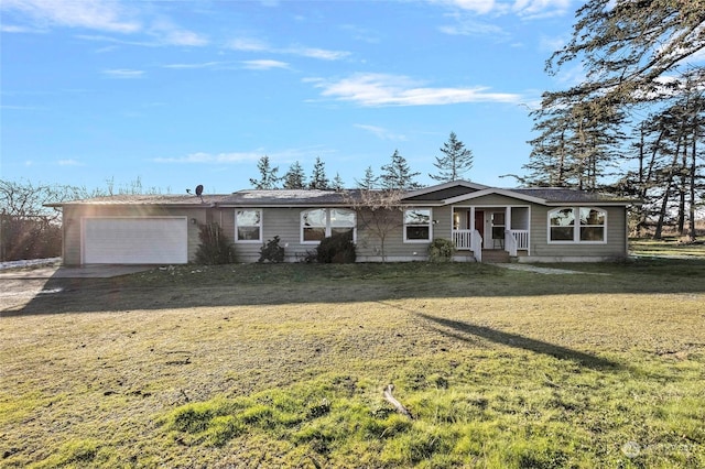 ranch-style house with a garage and a front lawn