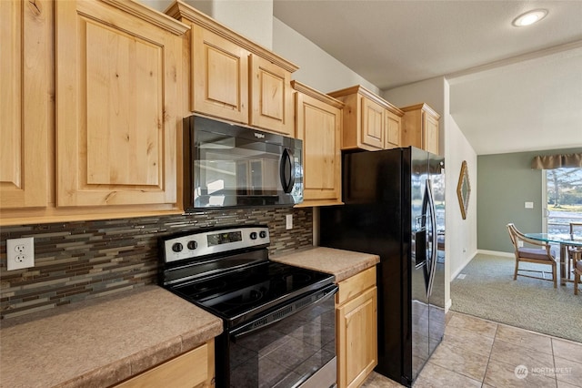 kitchen with backsplash, light tile patterned flooring, black appliances, and light brown cabinets