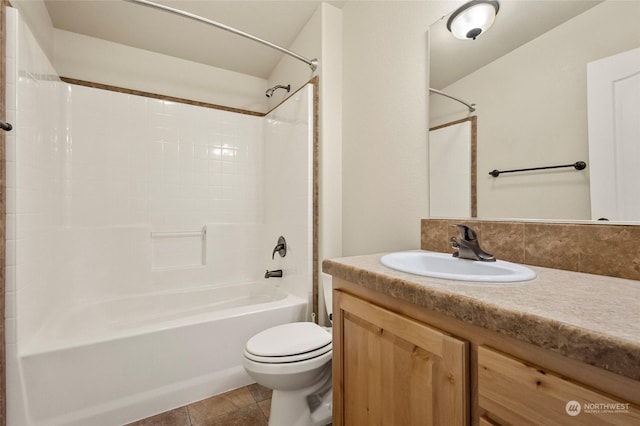 full bathroom with tile patterned flooring,  shower combination, vanity, and toilet