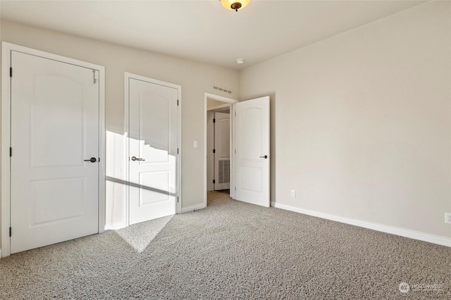 unfurnished bedroom featuring carpet