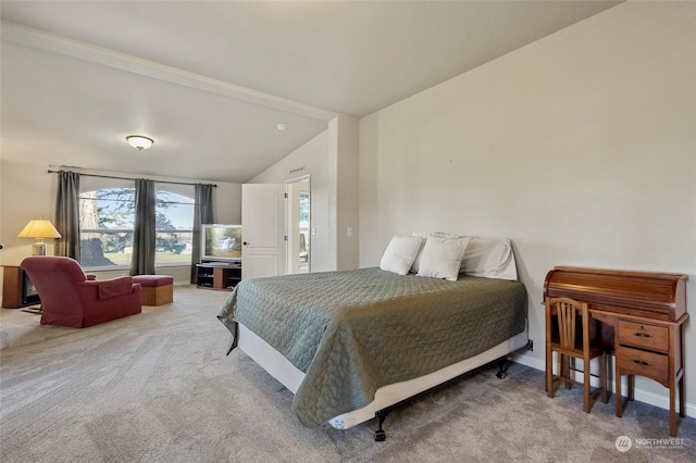 carpeted bedroom featuring vaulted ceiling