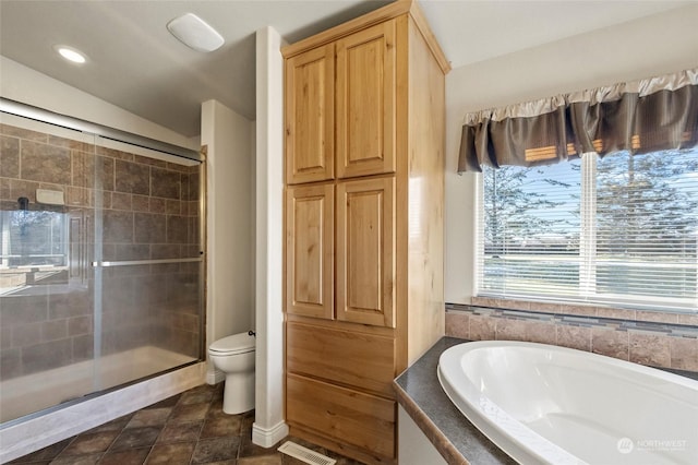 bathroom with plus walk in shower and toilet