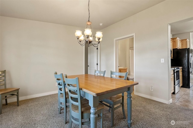 carpeted dining room featuring a chandelier