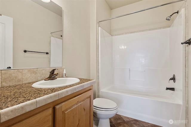 full bathroom featuring tile patterned floors, vanity, toilet, and shower / bathtub combination