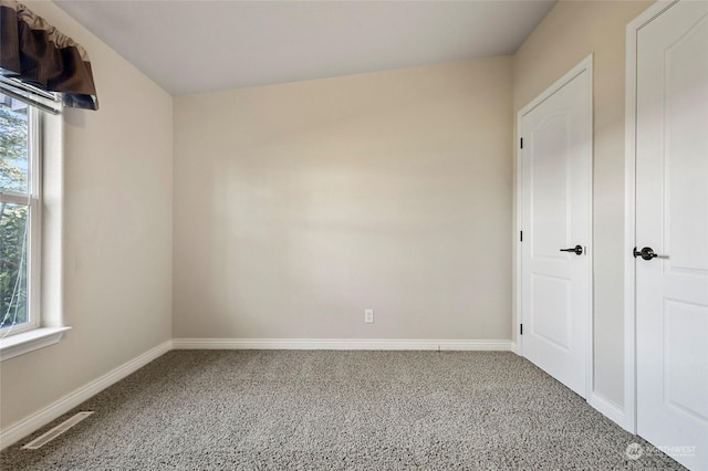 unfurnished bedroom with carpet flooring