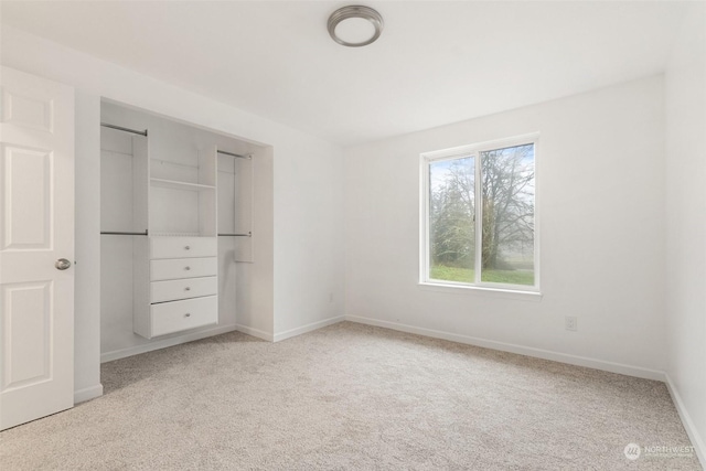 unfurnished bedroom featuring light colored carpet