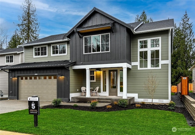 view of front facade featuring a garage, a porch, and a front lawn