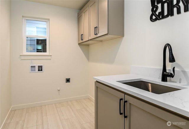 laundry area featuring cabinets, hookup for an electric dryer, washer hookup, sink, and gas dryer hookup