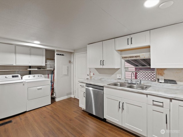 kitchen with separate washer and dryer, dishwasher, white cabinets, dark hardwood / wood-style flooring, and sink