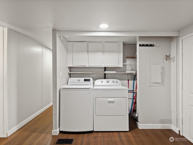 clothes washing area featuring separate washer and dryer and dark hardwood / wood-style floors