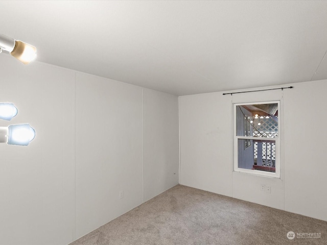 unfurnished room with carpet floors