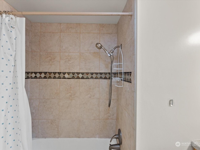 bathroom featuring shower / tub combo with curtain