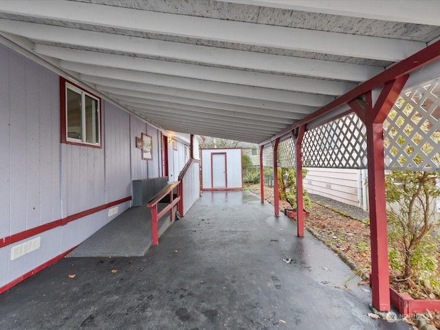 view of patio with a storage shed