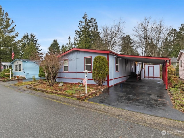 manufactured / mobile home with a carport