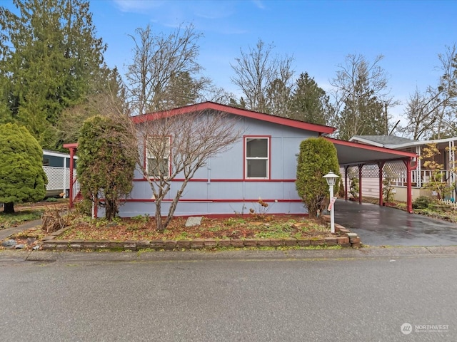 view of side of property featuring a carport