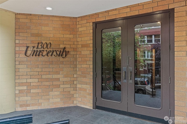 view of exterior entry featuring french doors