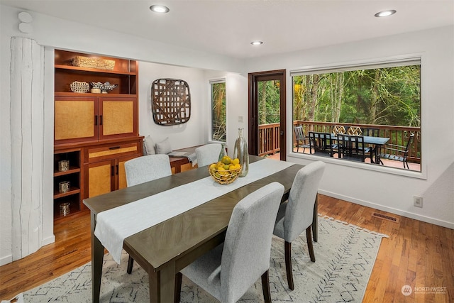 dining area with wood-type flooring