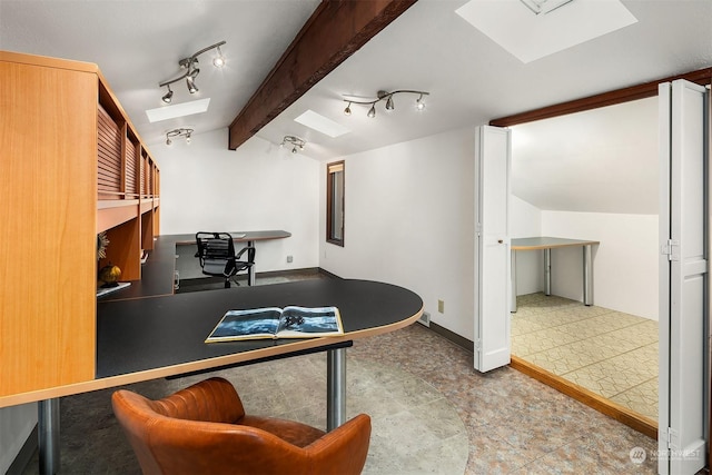 home office featuring lofted ceiling with beams