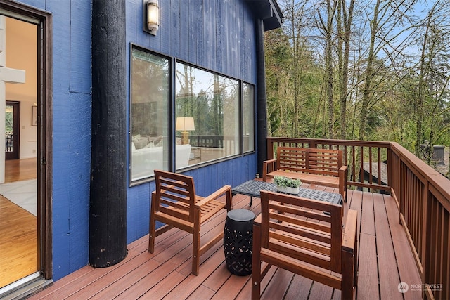 wooden deck with outdoor lounge area