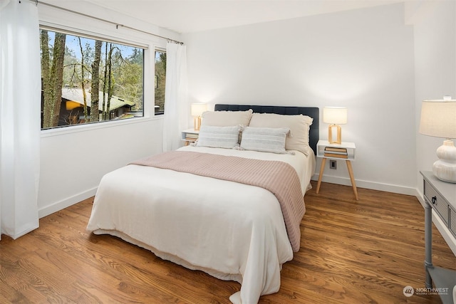 bedroom with hardwood / wood-style flooring