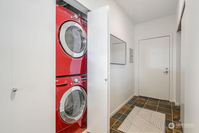 laundry area featuring stacked washer / dryer