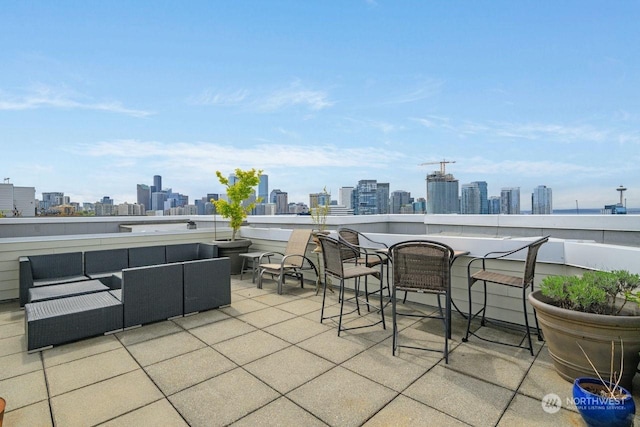 view of patio featuring a balcony and outdoor lounge area