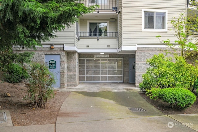 view of front of house with a balcony and a garage