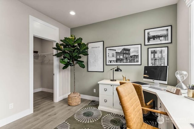 office with light hardwood / wood-style flooring