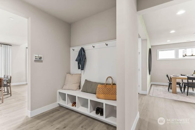 mudroom with light hardwood / wood-style floors